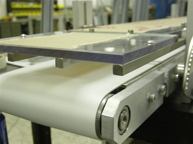 LP Conveyor with top hold down