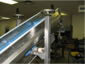 stainless steel incline conveyor with a baby blue belt